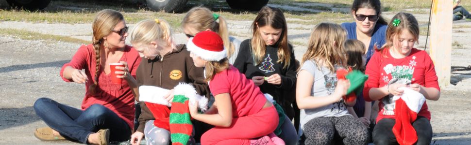 Kids watch on the streets at the 2015 Hatteras Village Christmas Parade